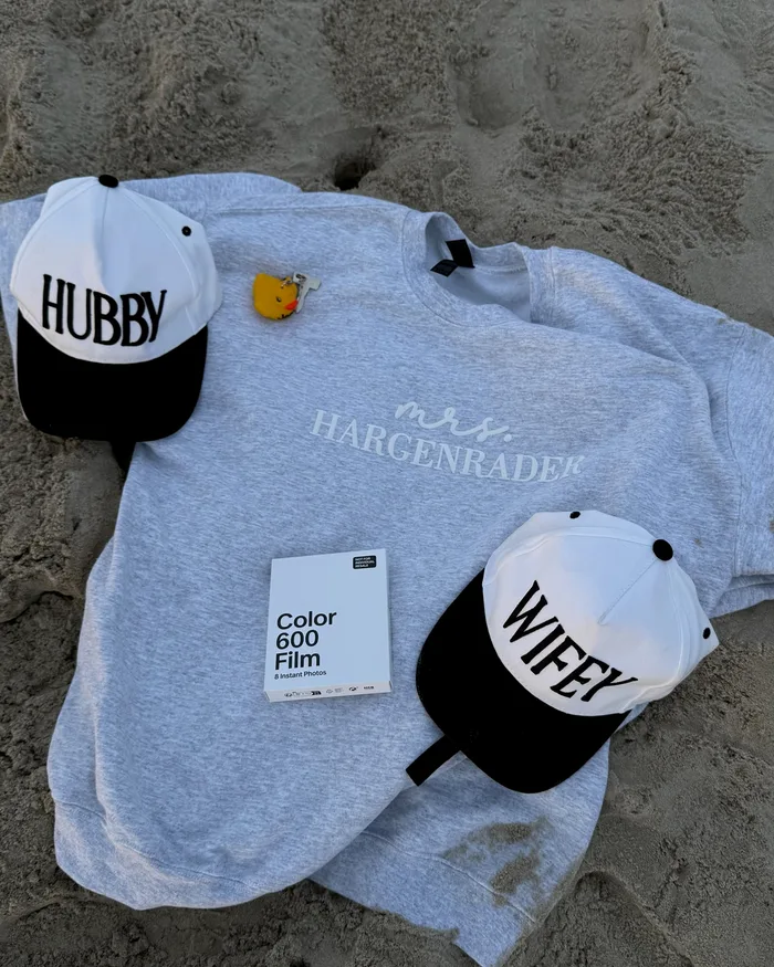 Hubby and Wifey hats with a 'Mrs. Hargenrader' sweatshirt on the beach